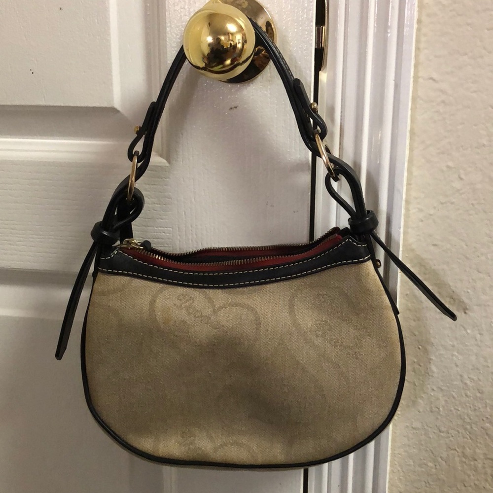 Dooney and Bourke small purse with leather strap